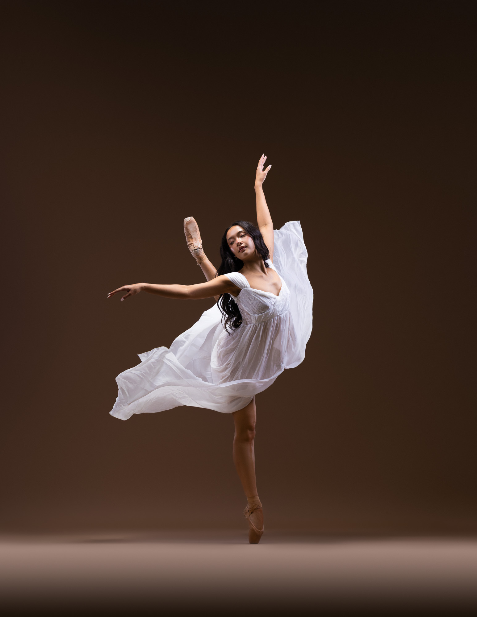 Dancer in flowing white fabric photographed by DFW Dance Photography