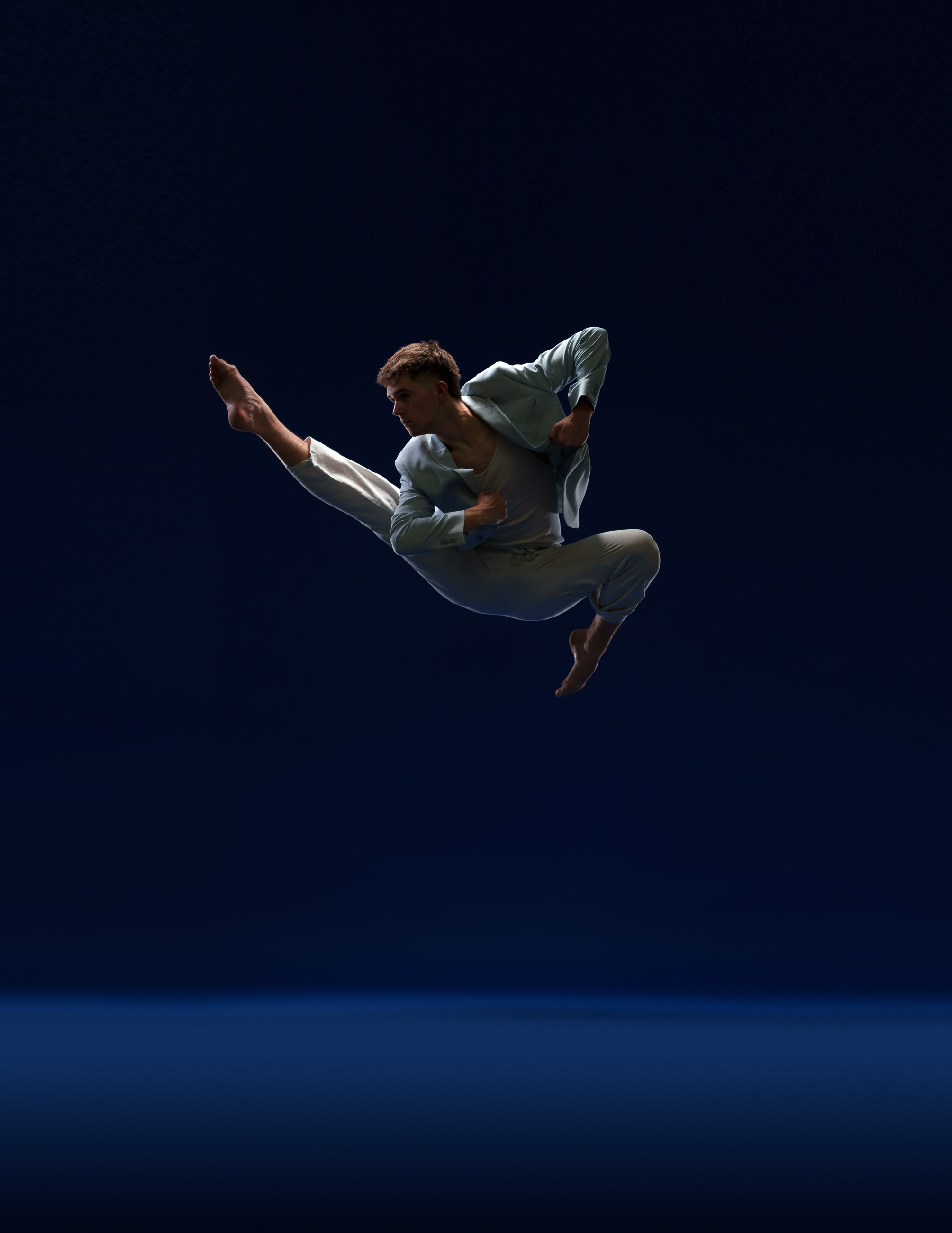 Male dancer photographed in motion by DFW Dance Photography