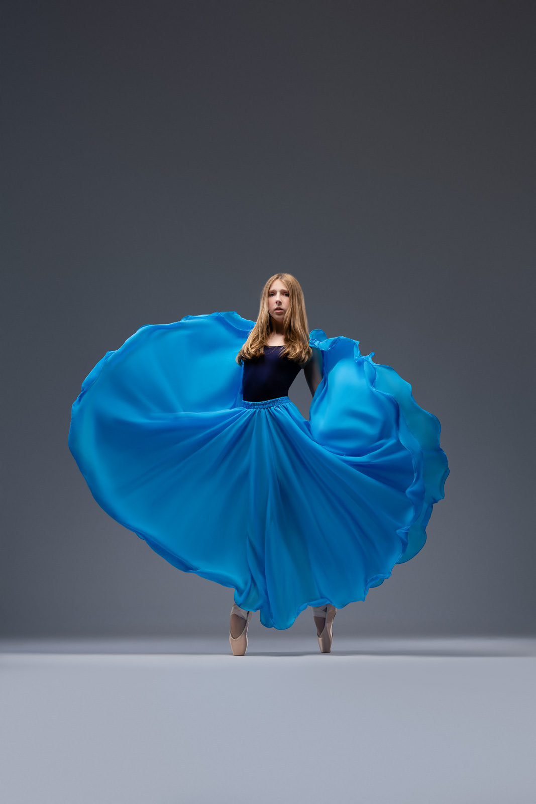 Creative dance portrait with flowing blue fabric by DFW Dance Photography