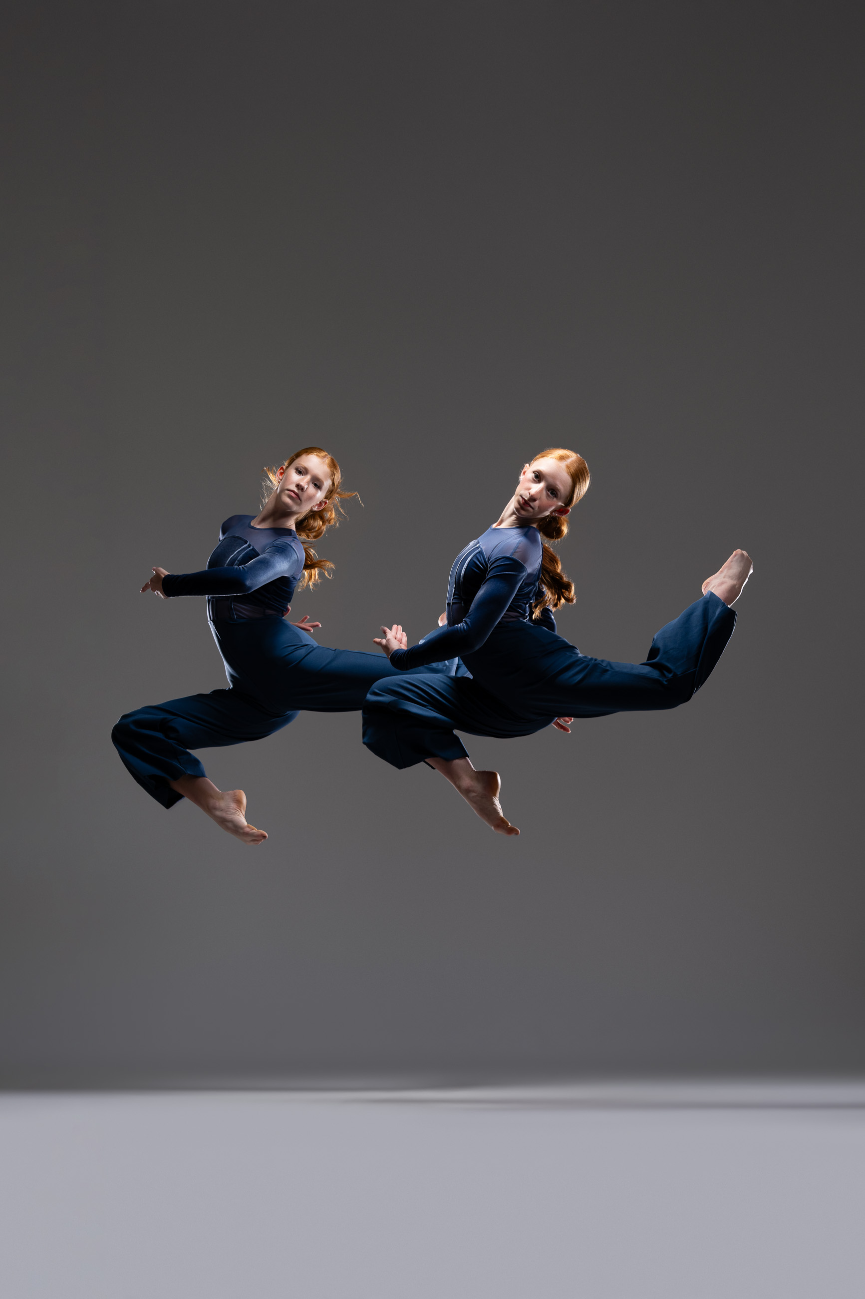 Two dancers photographed in motion by DFW Dance Photography